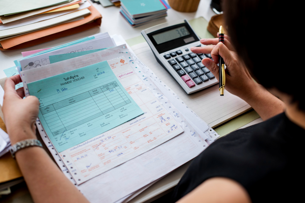 woman calculating for tax preparation Maurice LA